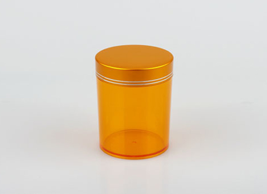 Frasco de plástico naranja transparente con tuerca de aluminio
